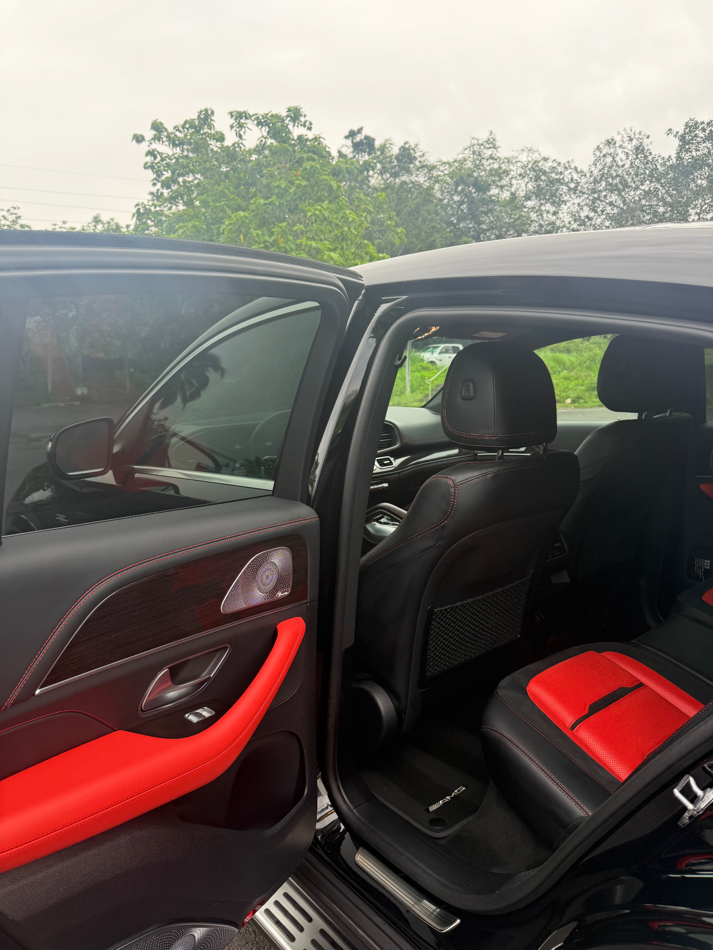 Actual GLE 53 rear cabin — black & red AMG seating with Burmester speakers