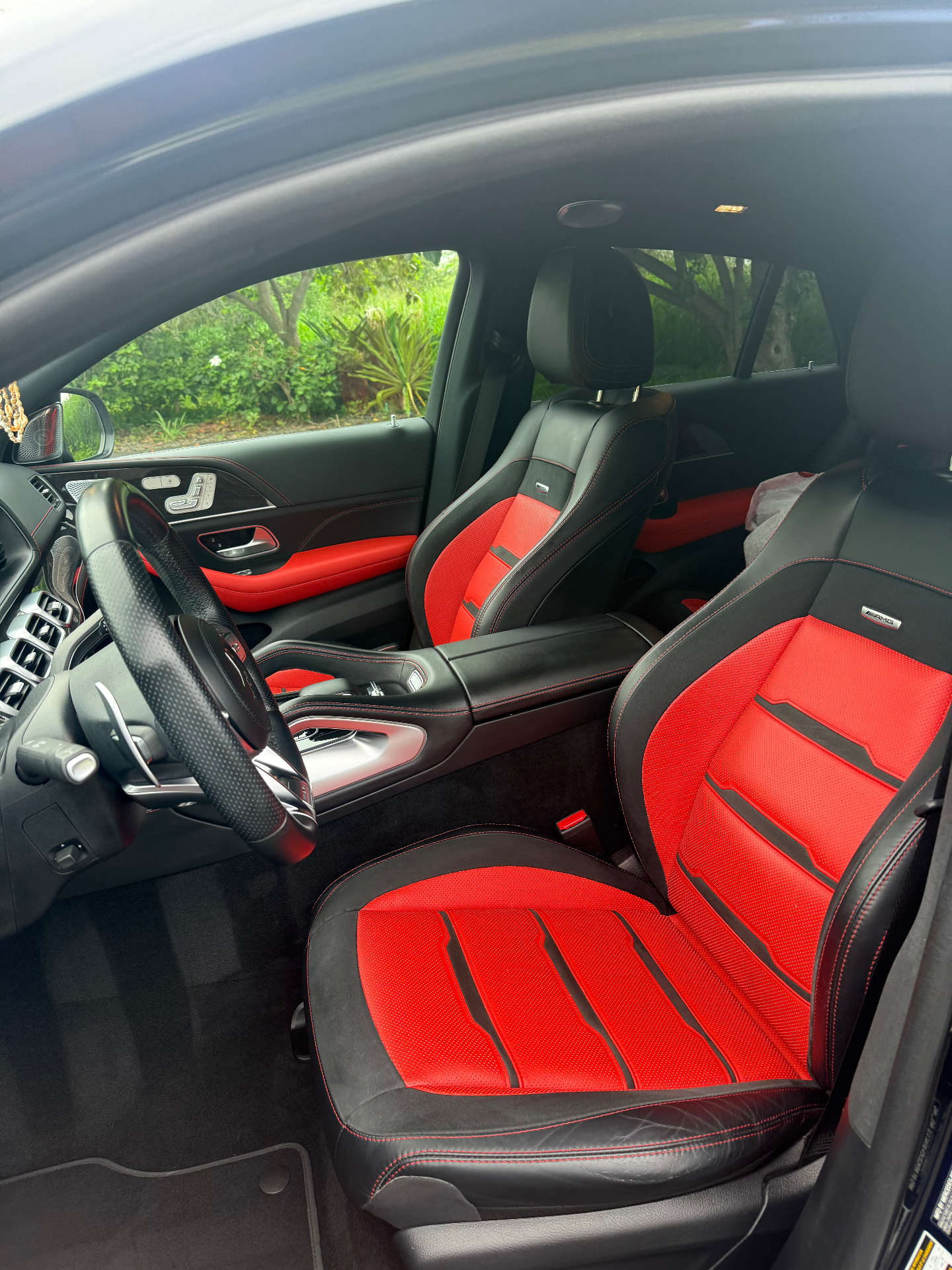 Actual GLE 53 red & black AMG performance interior — driver seat